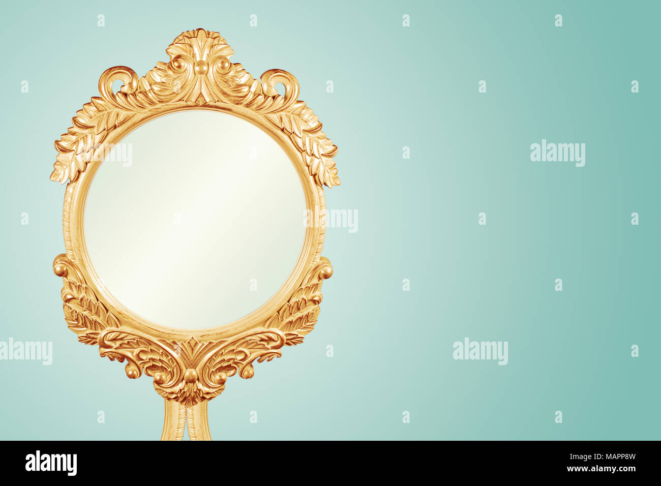 Antique Gilt Gold Frame Handcrafted Carved Wood Mirror Frame With Ornament Designs and Turquoise Background, Retro style, Ideal For Blank Space For Yo Stock Photo