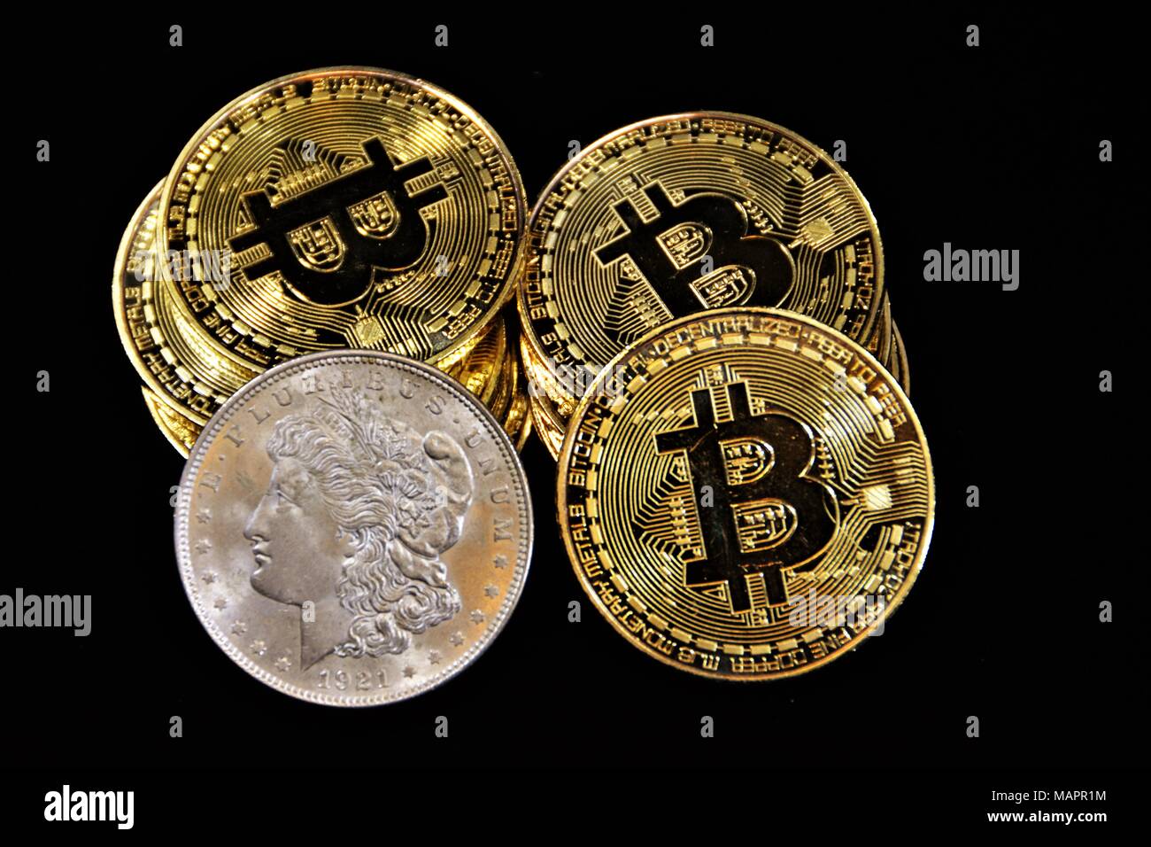 Bit coins with silver dollars and diamonds Stock Photo - Alamy