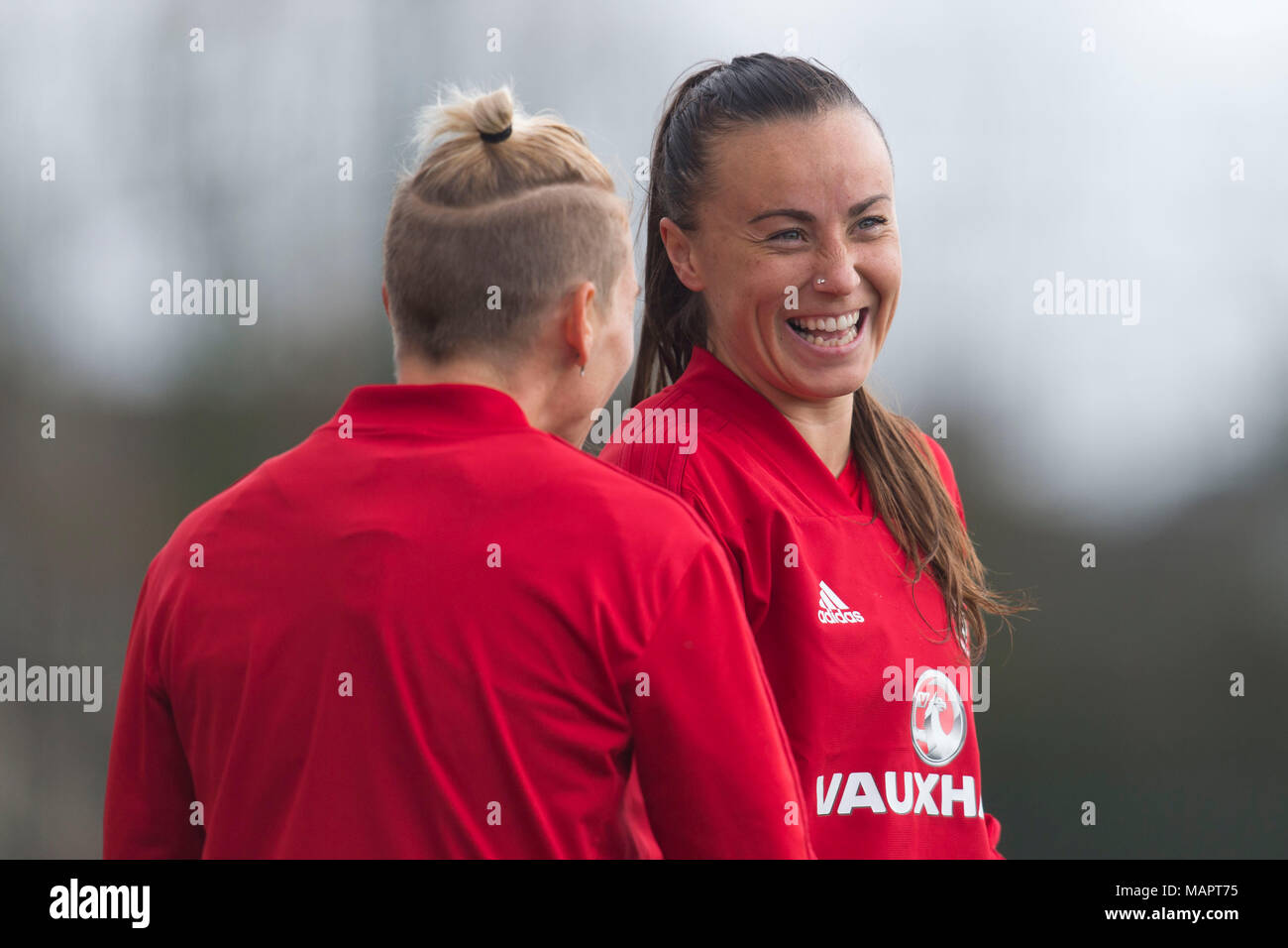 NEWPORT, WALES - APRIL 03: Jess Fishlock (L) and Natasha Harding laugh as the Wales women team train at Dragon Park ahead of the FIFA Women's World Cu Stock Photo