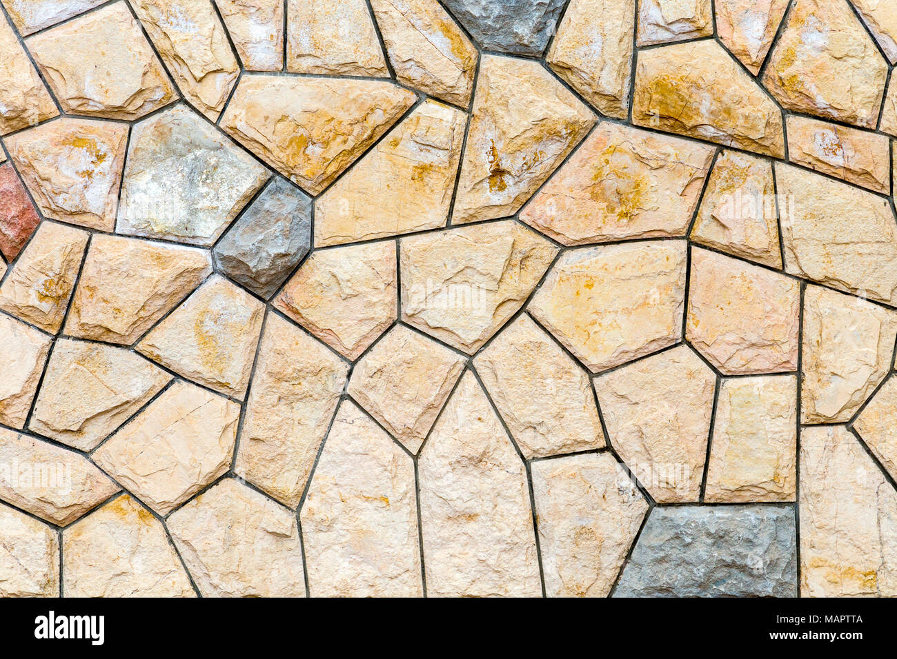 Stone wall made of asymmetrical tiles background Stock Photo Alamy