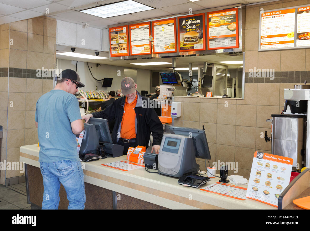 Man buying a whataburger, interior of a Whataburger burger store, Austin, Texas USA Stock Photo