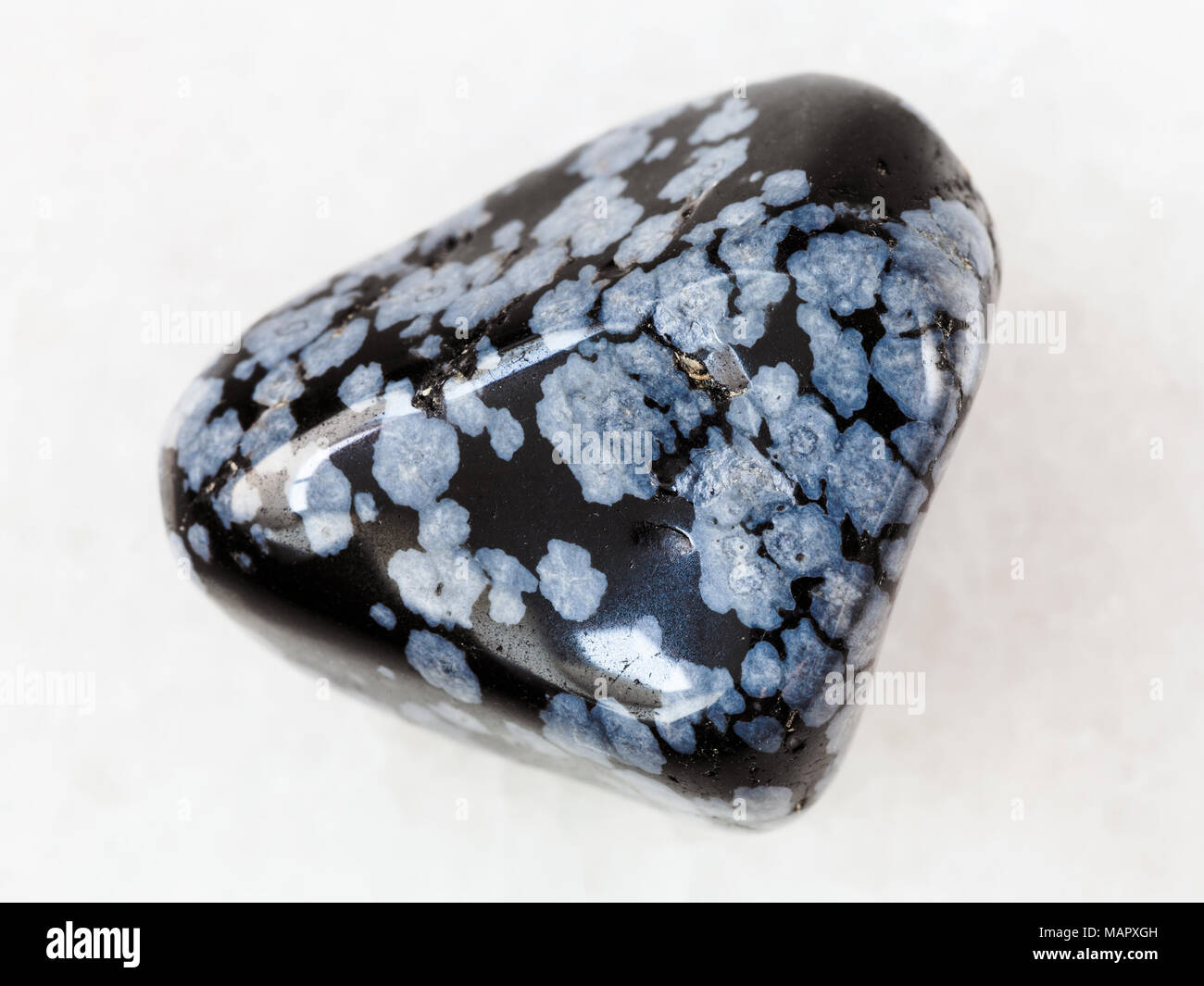 Macro Shooting Of Natural Mineral Rock Specimen Pebble Of Snowflake Obsidian Gem Stone On White Marble Background From Usa Stock Photo Alamy