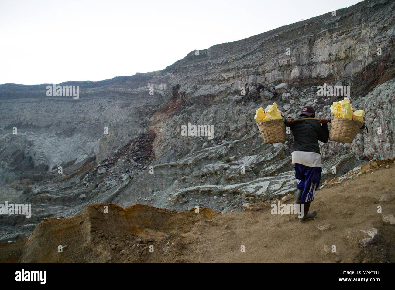 Sulphur miner of Ijen volcano, Eastern Java, Indonesia, Southeast Asia, Asia Stock Photo