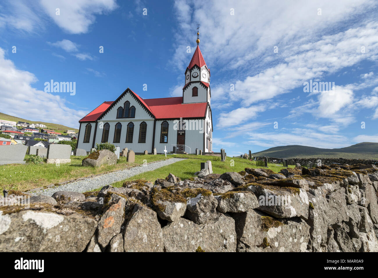 Church and cemetery in Sandavagur, Vagar Island, Faroe Islands, Denmark, Europe Stock Photo