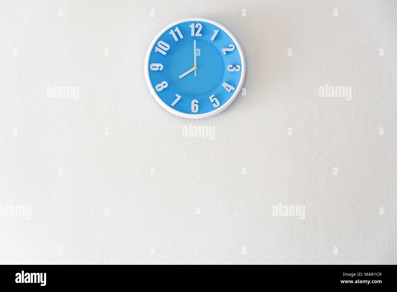 Good morning or night time with 8:00 clock on white concrete wall interior background with copy space, message board concept. Good morning is the gree Stock Photo
