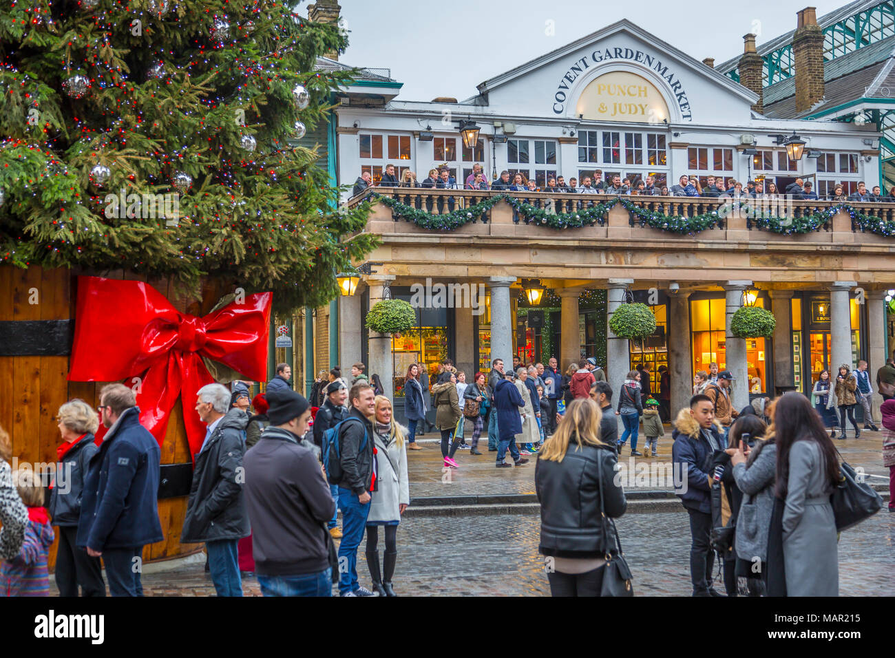 Visitors and Christmas decorations in Covent Garden Market, London