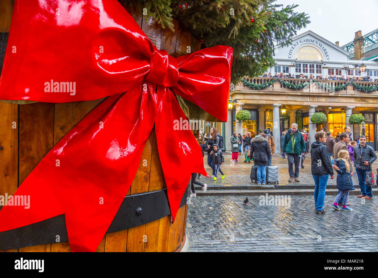 Visitors and Christmas decorations in Covent Garden Market, London