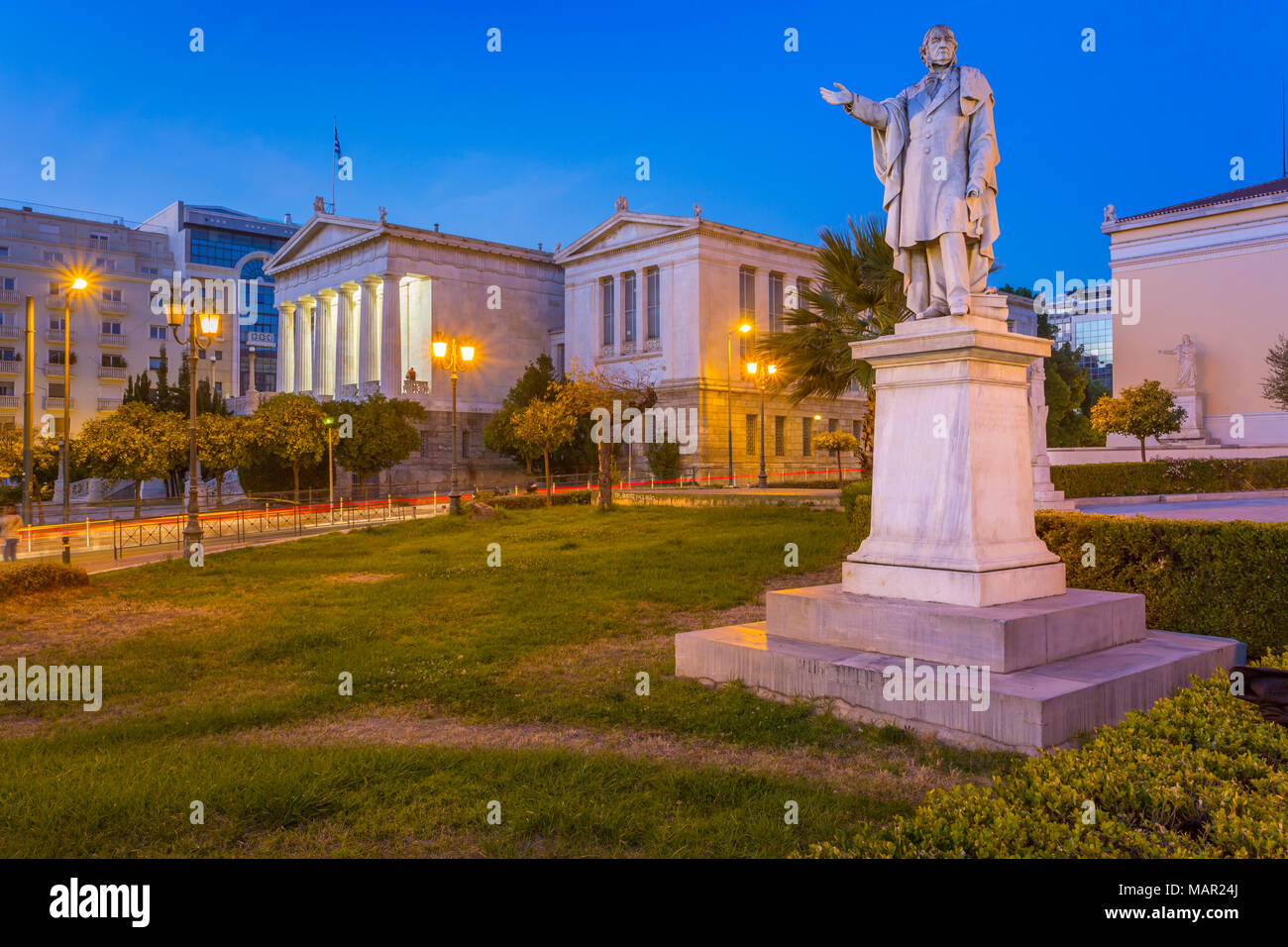 View of the statue and National Library of Greece at dusk, Athens, Greece, Europe Stock Photo