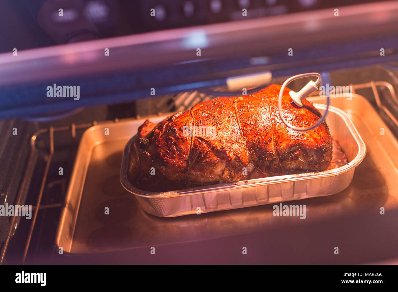 Cooking lamb roast in residential oven Stock Photo - Alamy