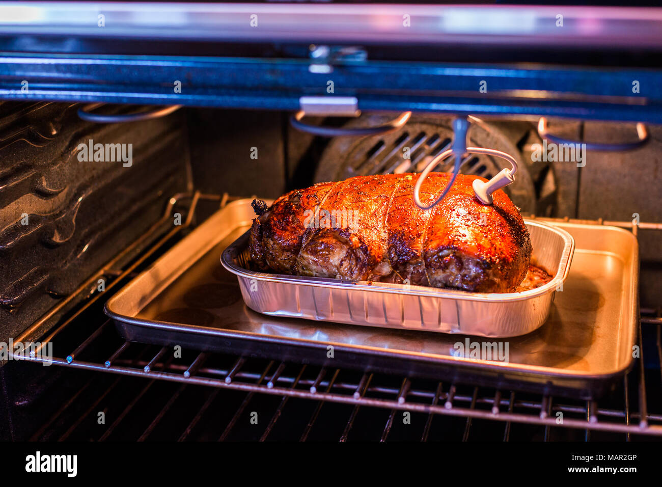 Cooking lamb roast in residential oven Stock Photo - Alamy