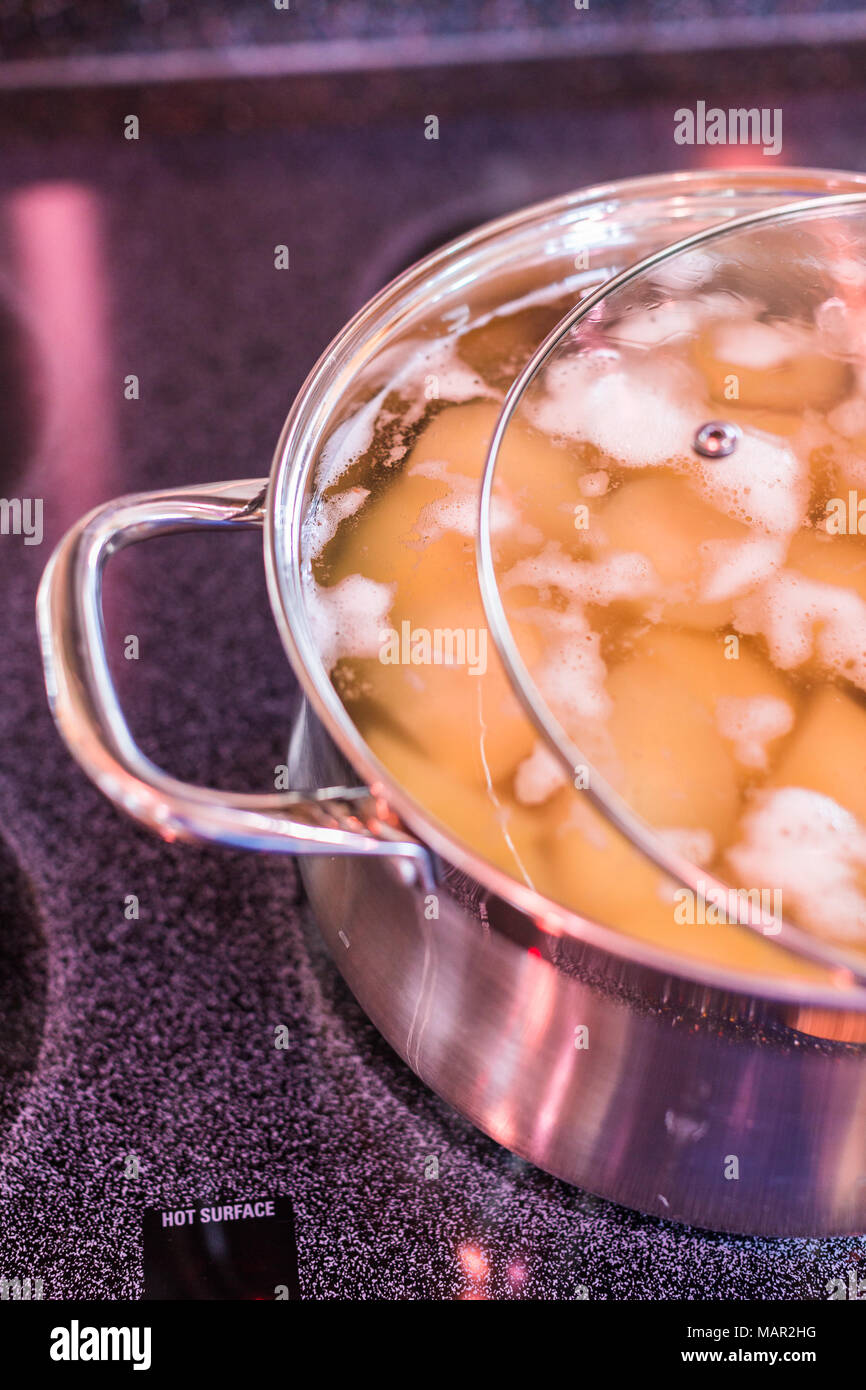 Boiling Potatoes In Large Cooking Pot On Electric Stove Stock