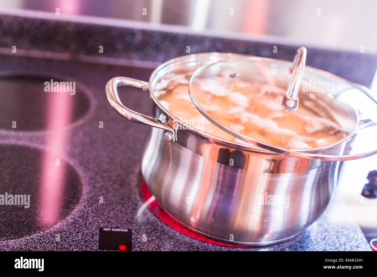 Boiling Potatoes In Large Cooking Pot On Electric Stove Stock