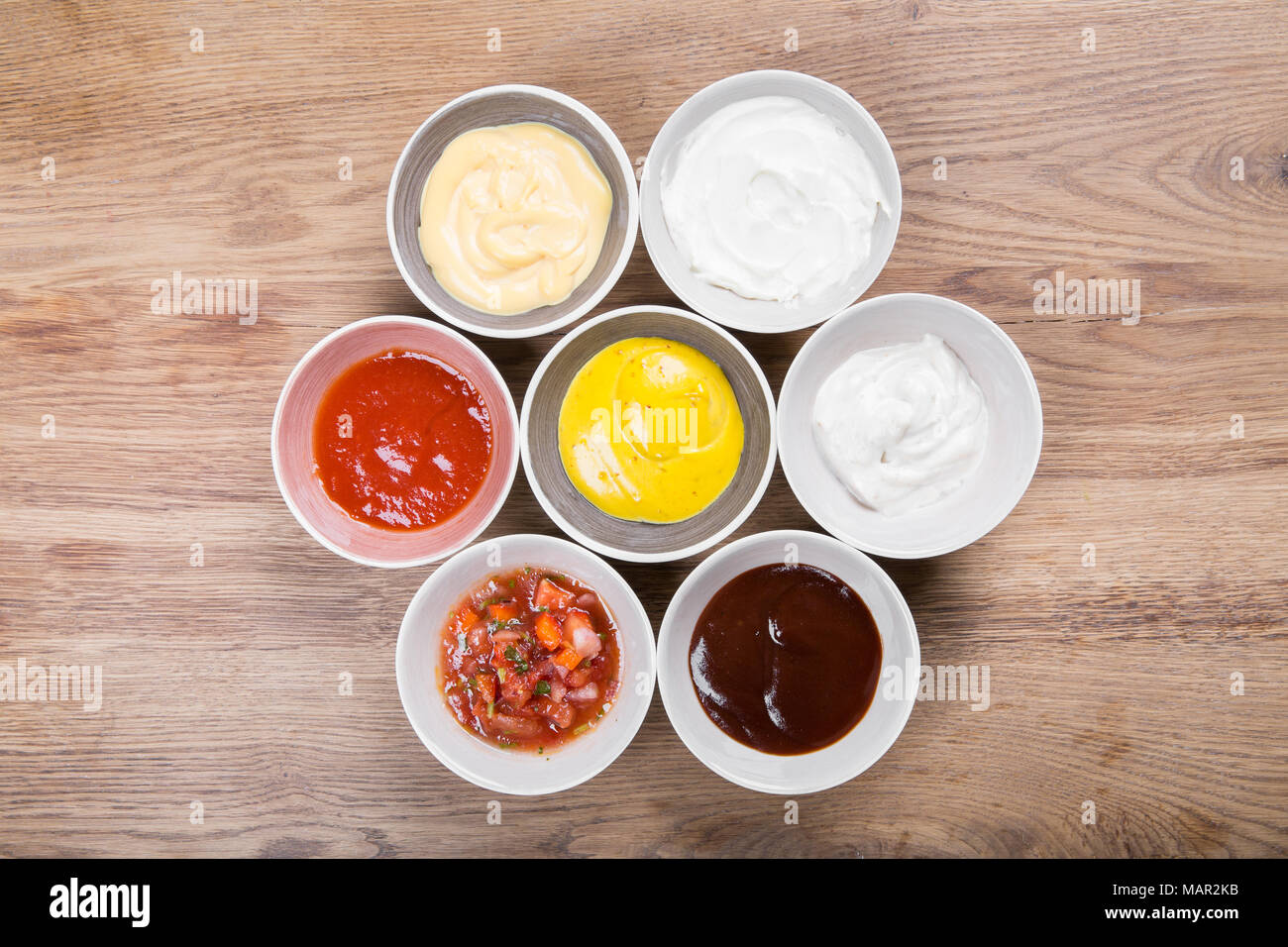 Set of sauces ketchup, mayonnaise, mustard soy sauce, bbq sauce, mustard grains and