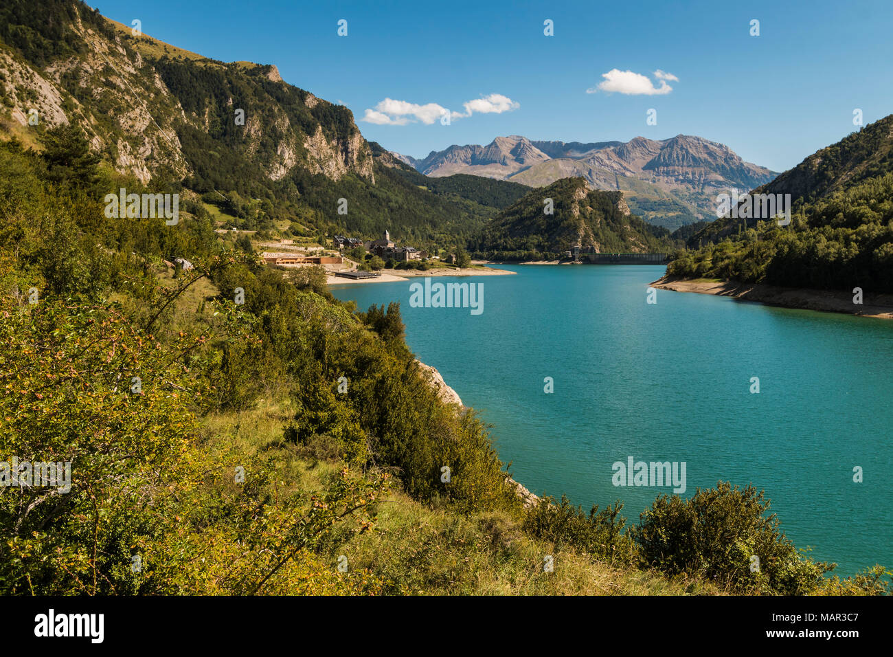 Lanuza village and resevoir, with Sierra Tendenera range beyond, Tena Valley, Sallent de Gallego, Pyrenees, Huesca Province, Spain, Europe Stock Photo