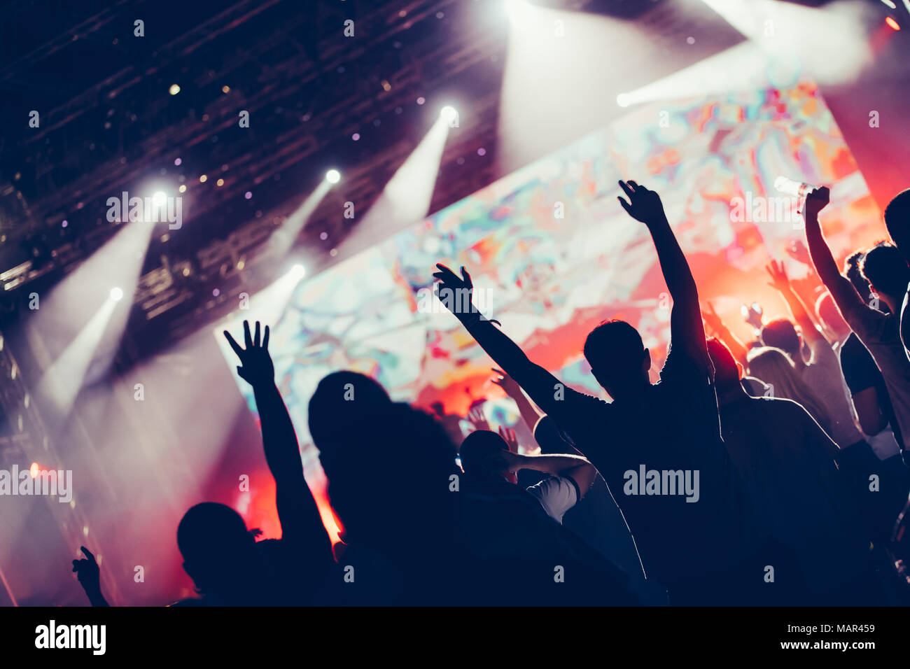Cheering crowd with hands in air at music festival Stock Photo - Alamy