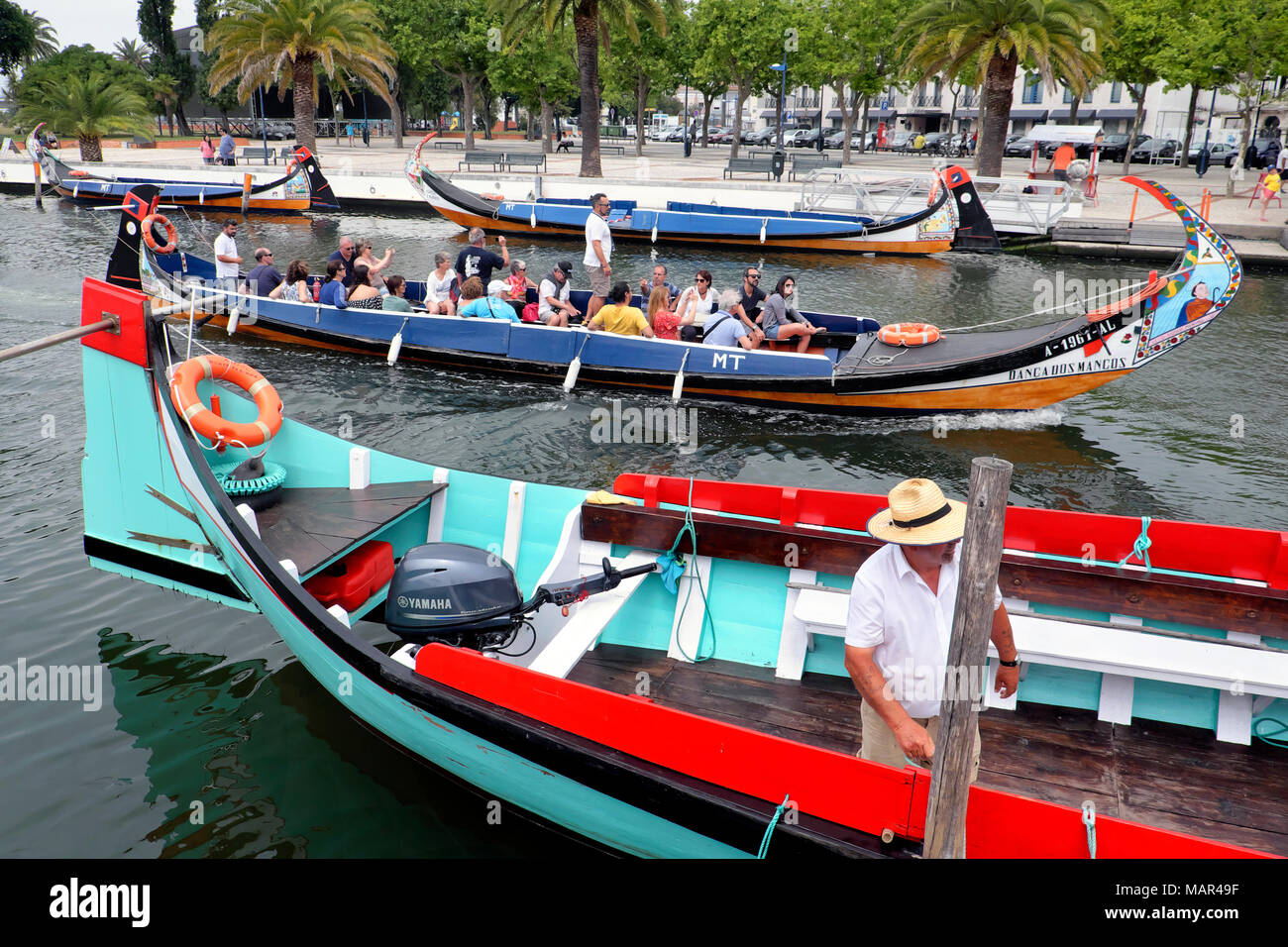 Tourists on a moliceiro boat canal trip, Aveiro, Centro Region, Portugal Stock Photo