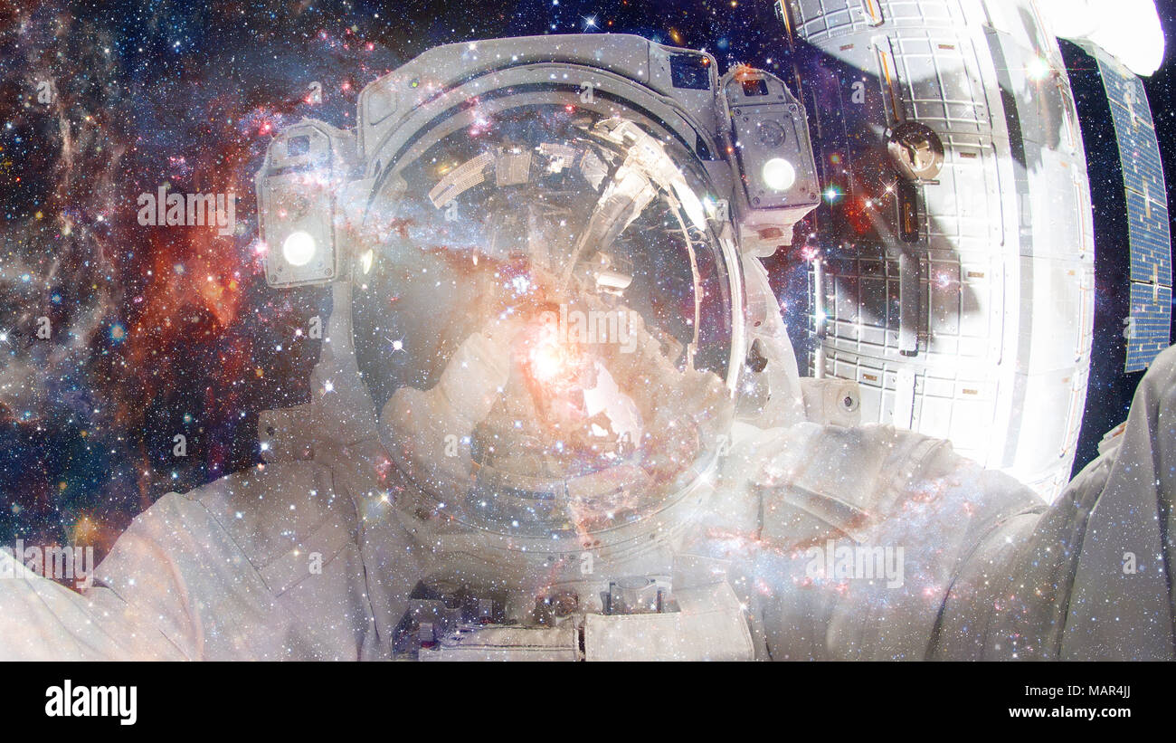 Astronaut in outer space. Science fiction art. Elements of this image ...