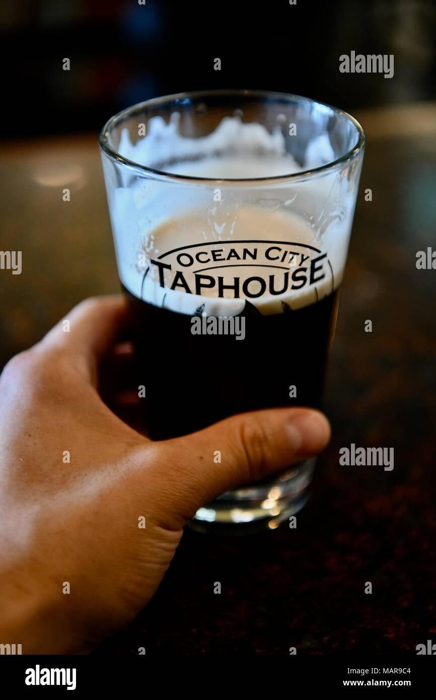Pint of draft or draught beer on the table at the Ocean City Taphouse, Maryland, USA Stock Photo