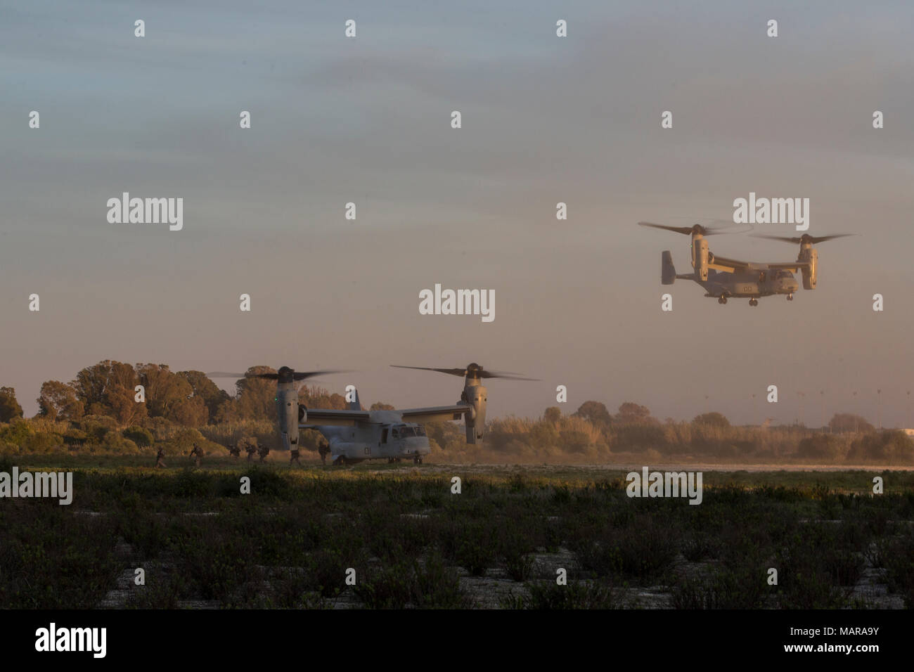 Marines with Special Purpose Marine Air-Ground Task Force-Crisis Response-Africa disembark MV-22 Ospreys during tactical recovery of aircraft and personnel (TRAP) training at Naval Station Rota, Spain, March 28, 2018. SPMAGTF-CR-AF deployed to conduct crisis-response and theater-security operations in Europe and North Africa. (U.S. Marine Corps photo by SSgt Britni M. Garcia Green/Released) Stock Photo