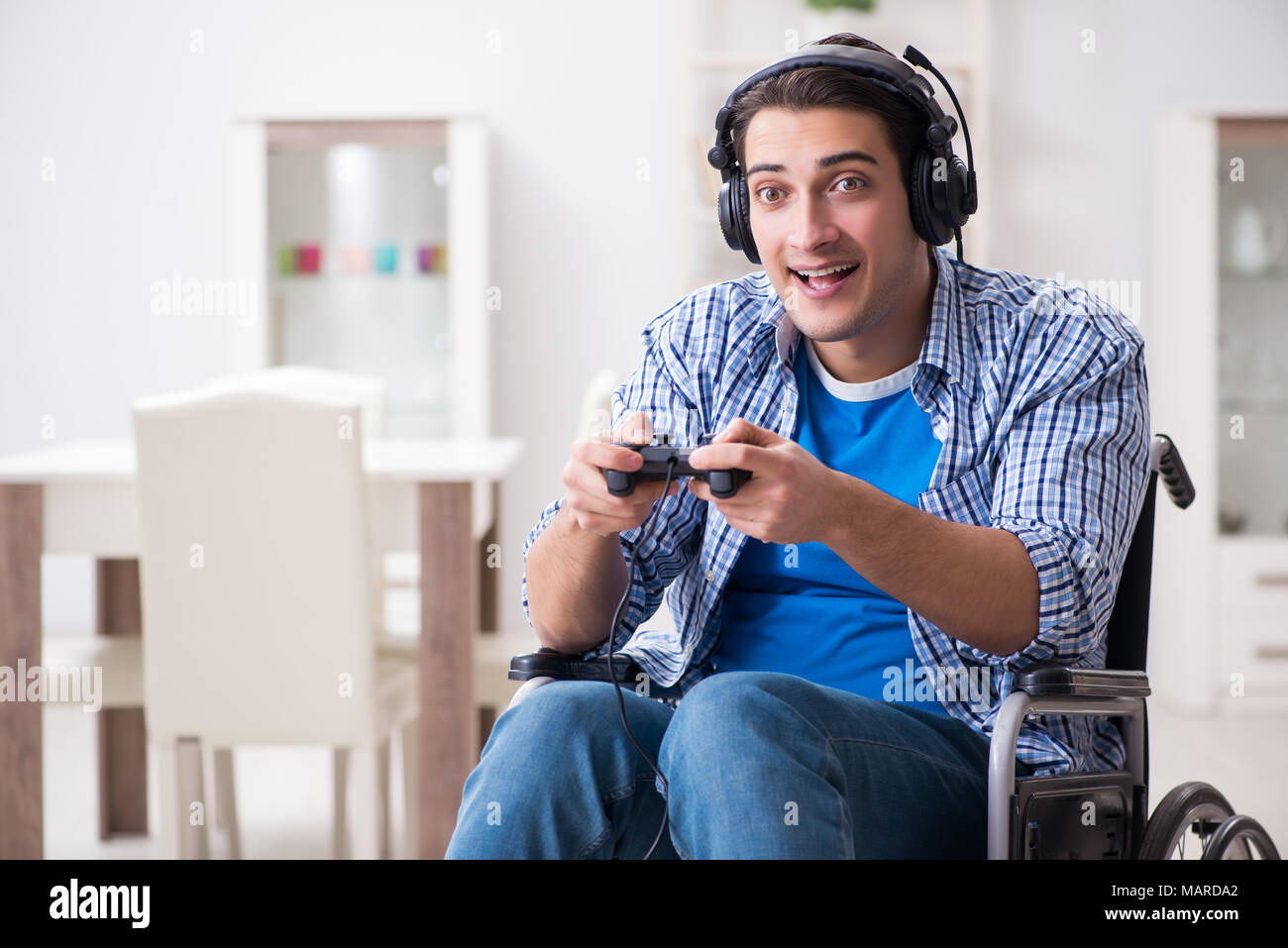 Disabled man playing computer games during rehabilitation Stock Photo Alamy