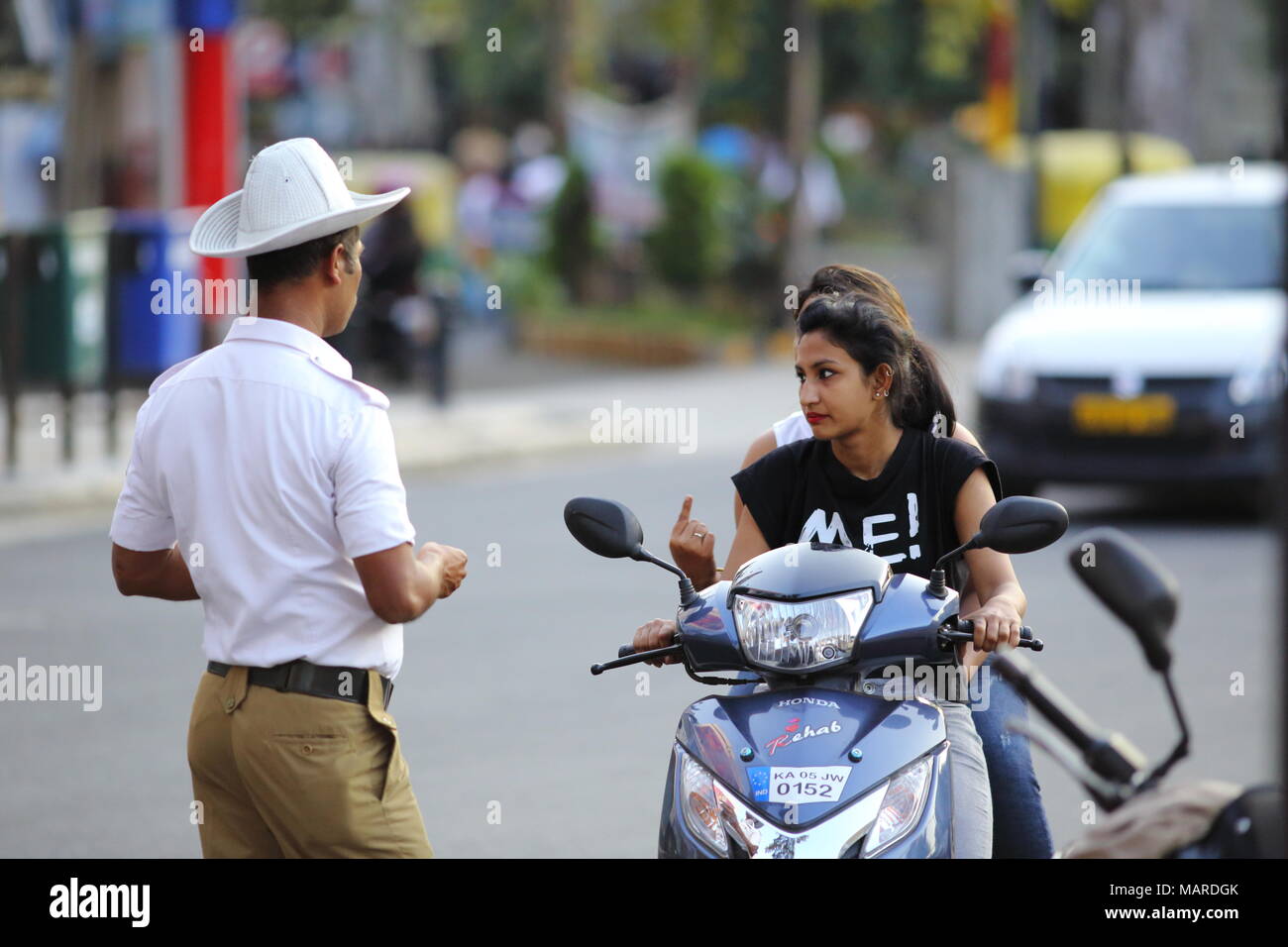Bangalore, India October 16, 2016 A local traffic police catches