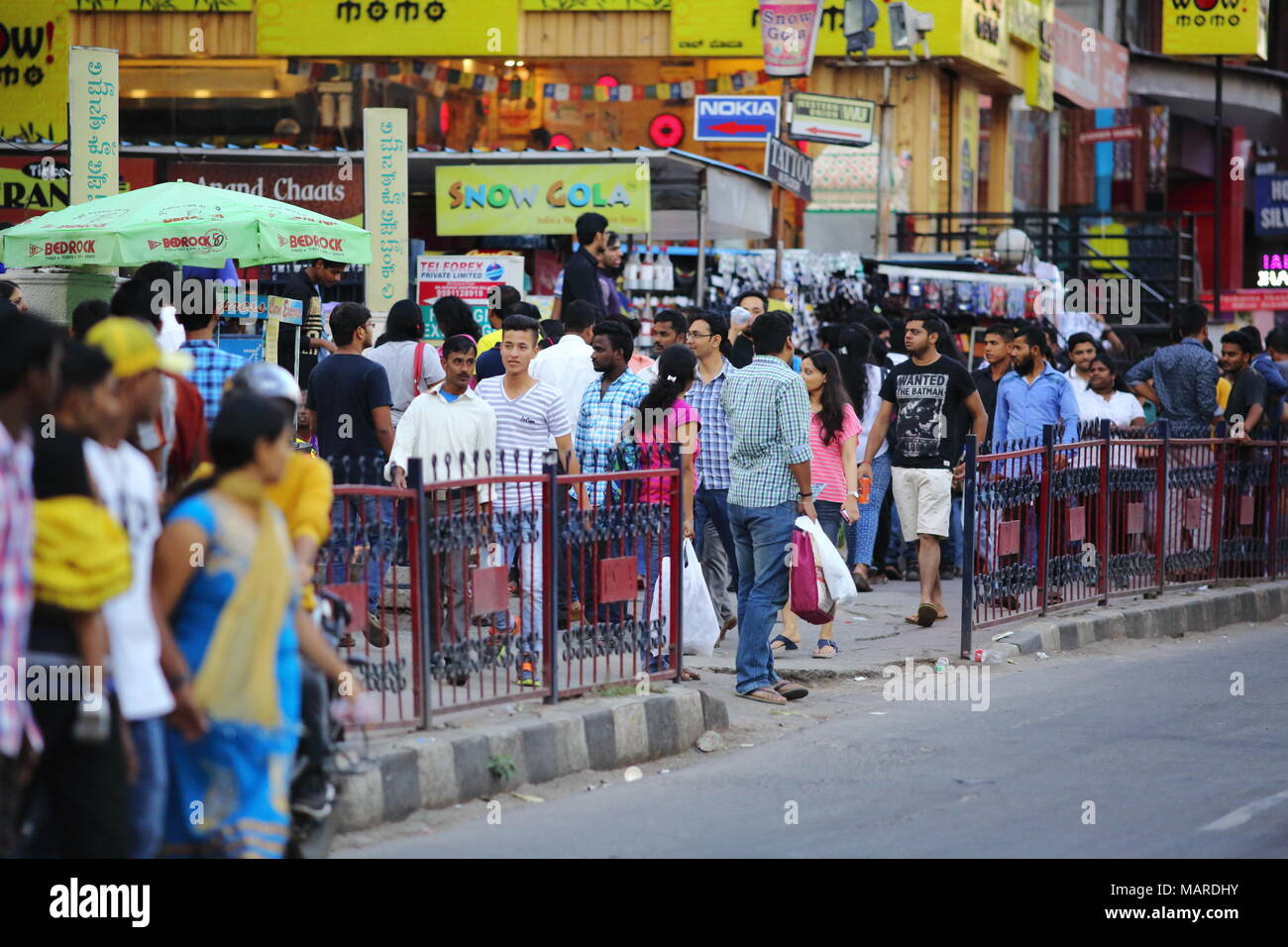 Bangalore, India - October 16, 2016: Moving crowd in the evening rush hour at Brigade Road. Brigade road is one of the busiest place in the city. Stock Photo