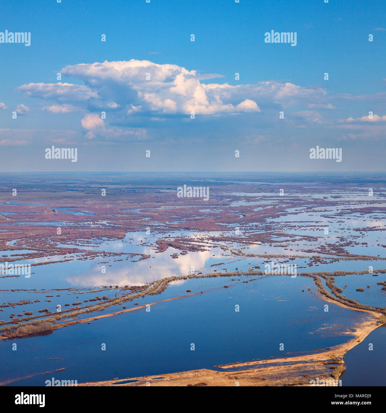 Aerial view of flood-land beside great river during spring Stock Photo