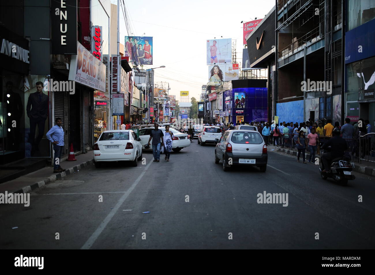 Bangalore, India - October 16, 2016: Moving traffic and crowd in rush hours at Brigade Road, Bangalore. Stock Photo