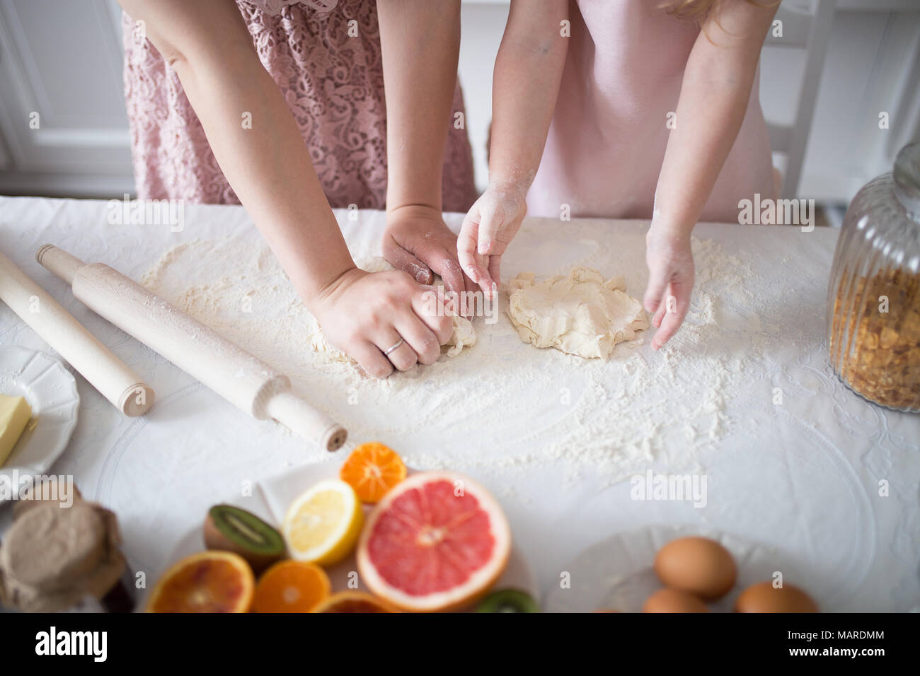 Mother And Daughter Making A Daugh For The Cookies Stock Photo