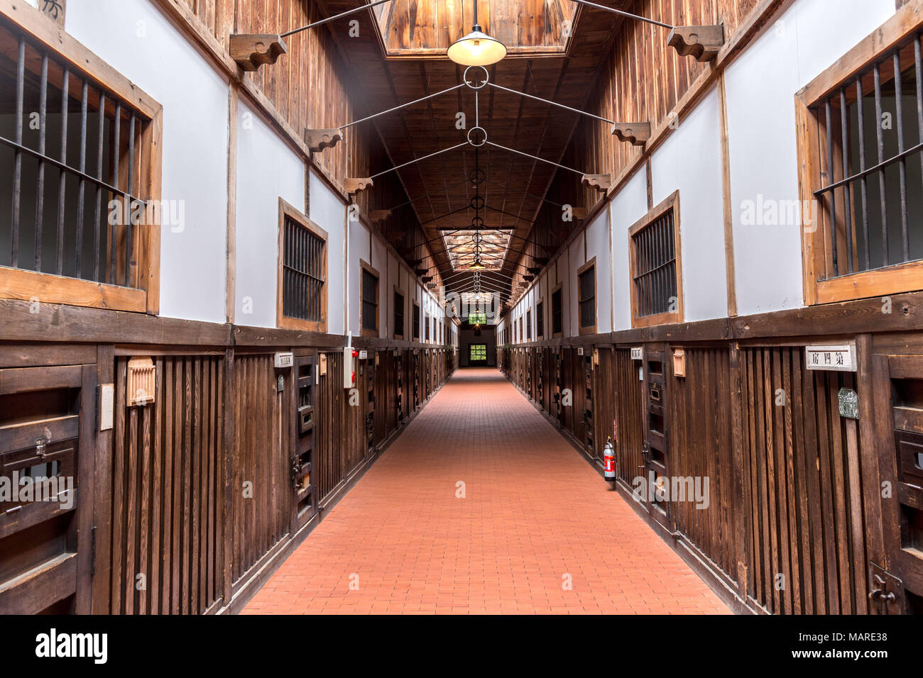 Hokkaido, Japan - August 10, 2017: Interior corridor in one of the many cell blocks where political prisoners were held during the Meiji Era Stock Photo