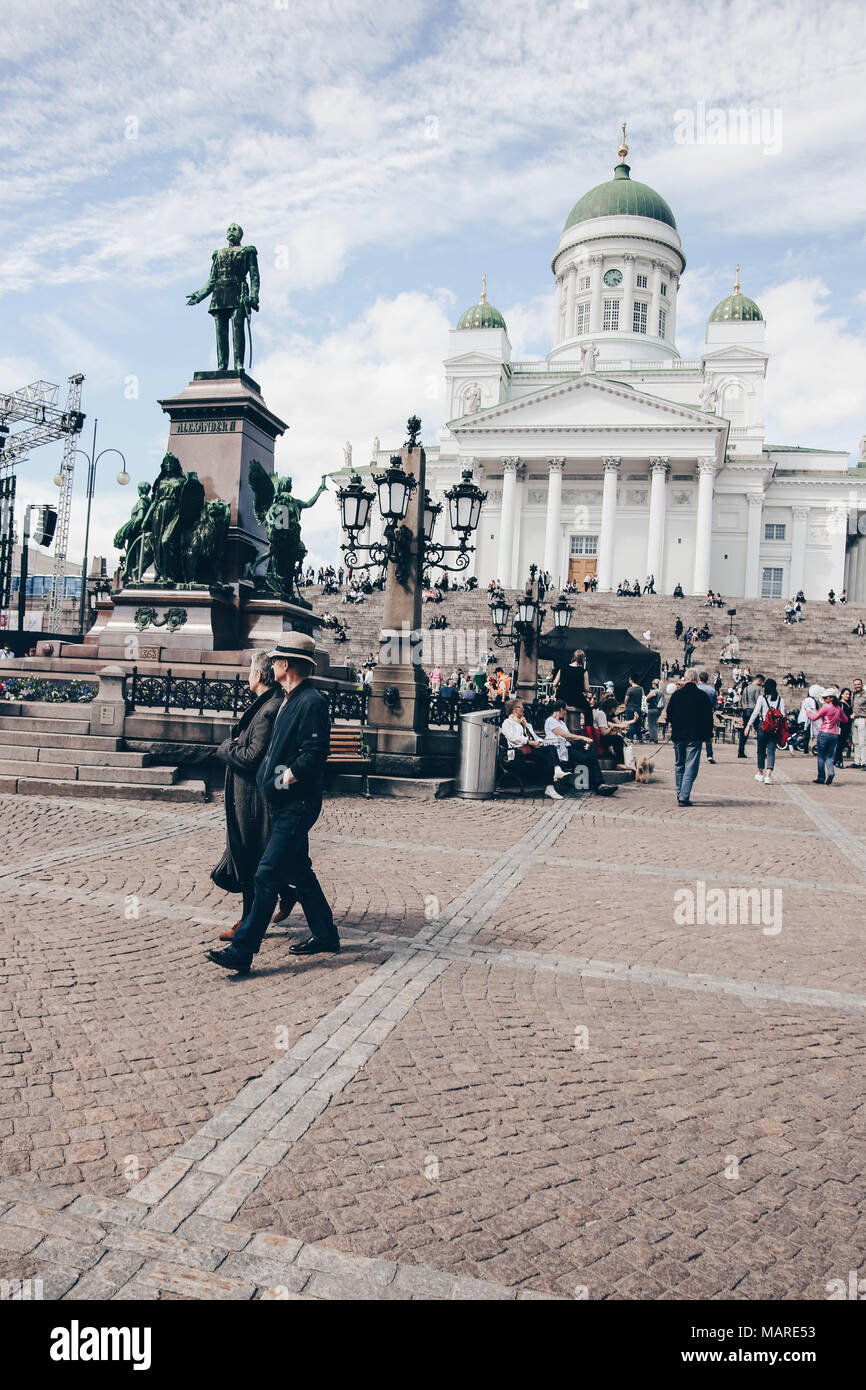 Helsinki, Finland – May 20, 2017: An older couple walking in front of Helsinki Cathedral at the Senate Square Stock Photo