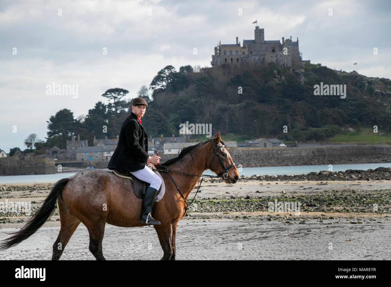Handsome Male Horse Rider On Horseback Wearing Flat Cap White