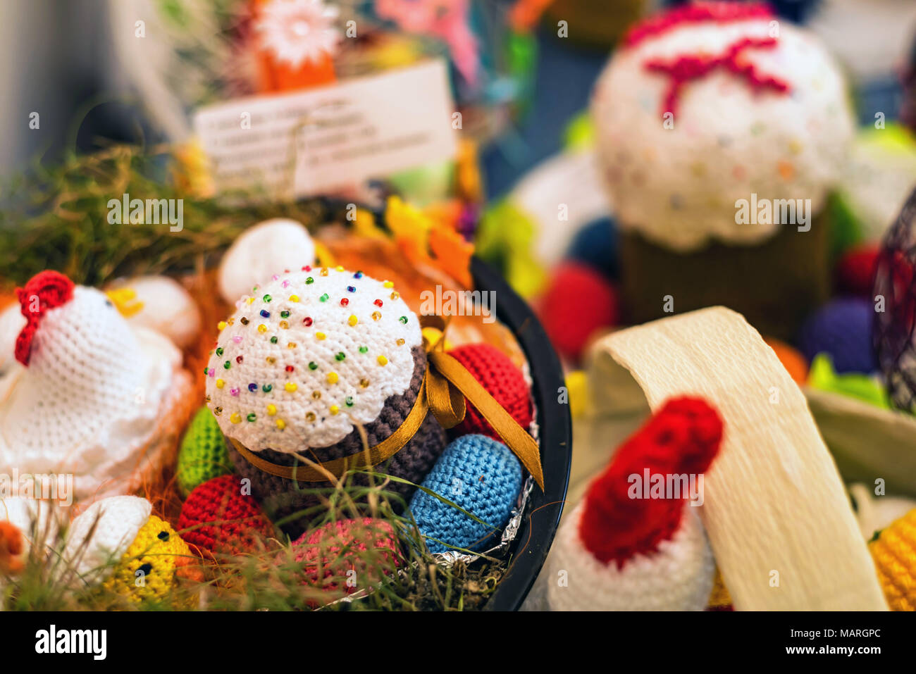 Knitted easter cake and eggs in the basket Stock Photo