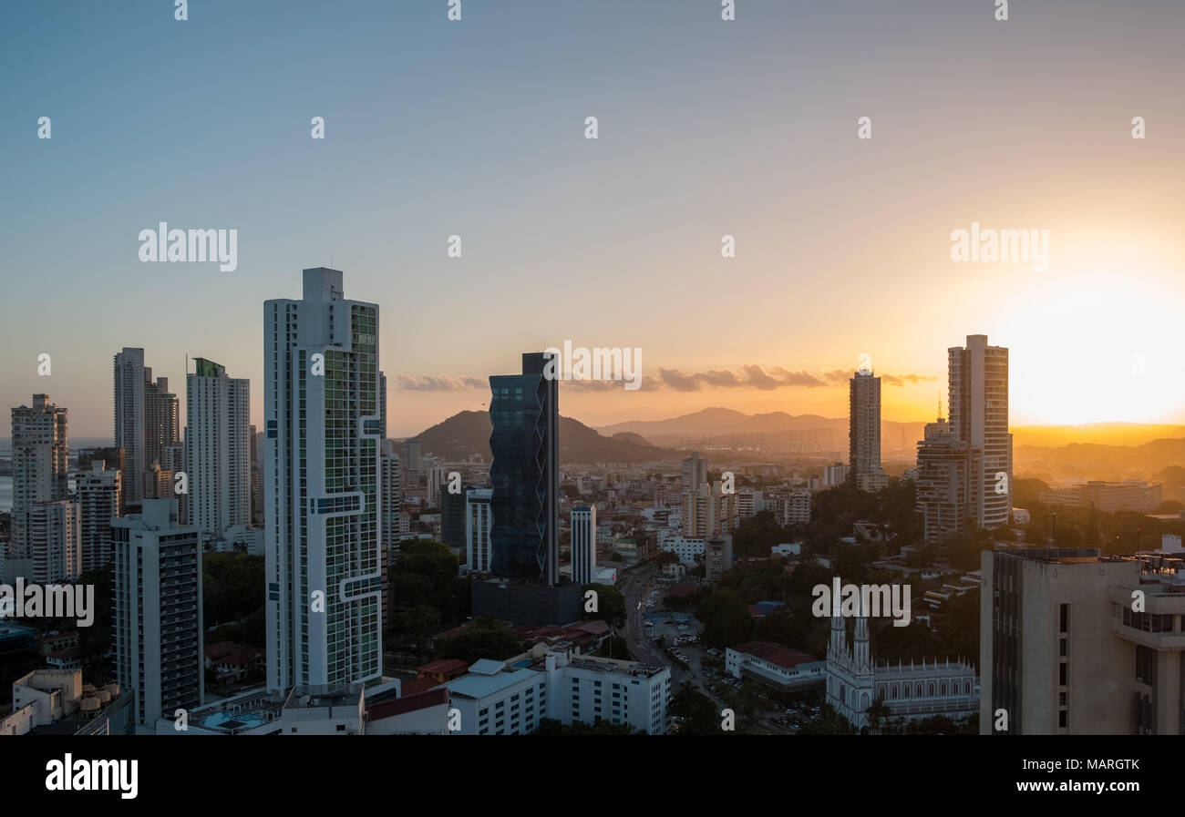 sunset sky over modern city skyline from high viewpoint  - Stock Photo