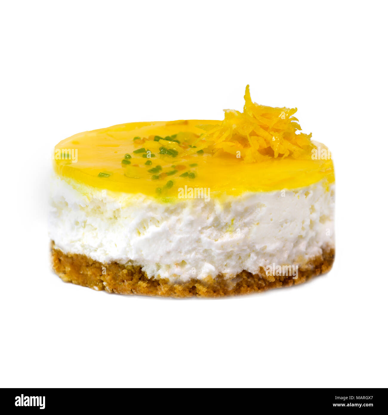 creamy lemon mousse cheesecake on a white isolated background with a small decorations round in shape room for text Stock Photo