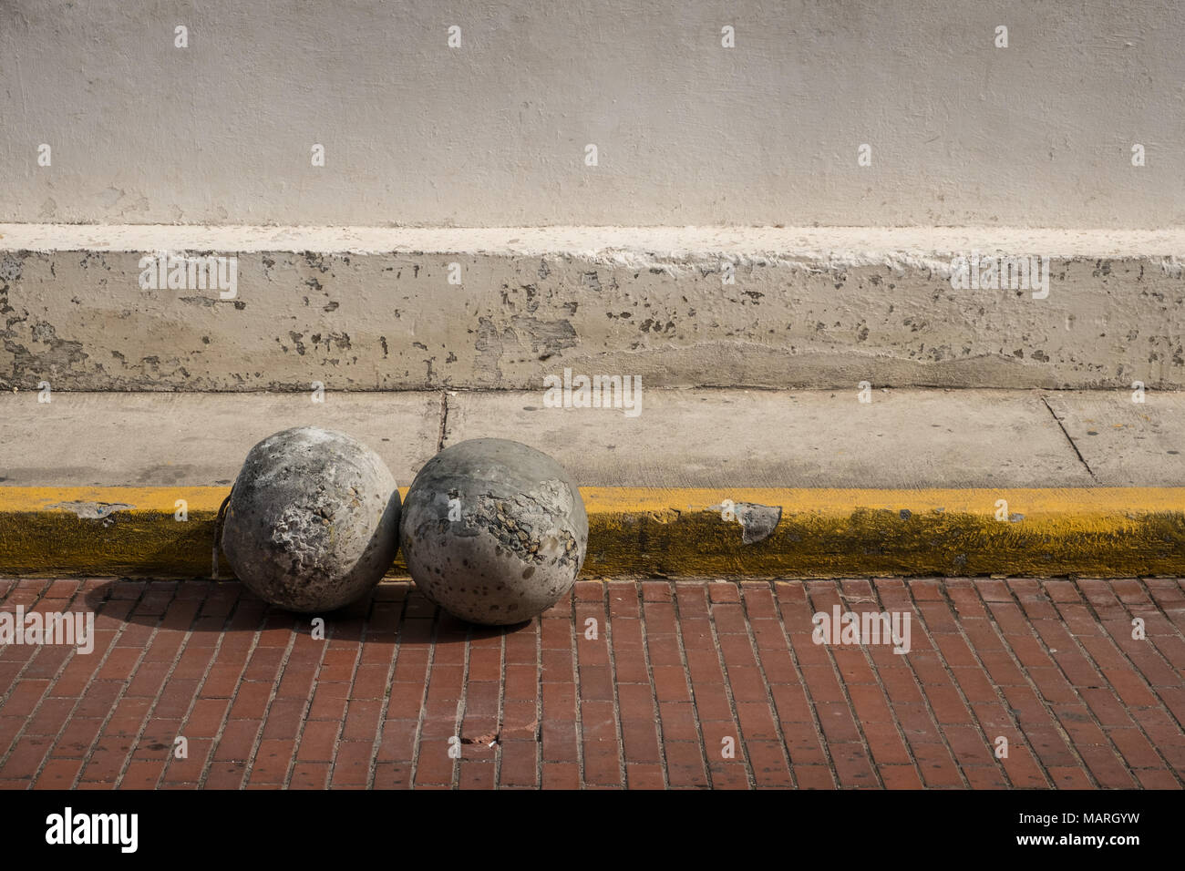 concrete balls on road - stone bollard , no parking concept - Stock Photo