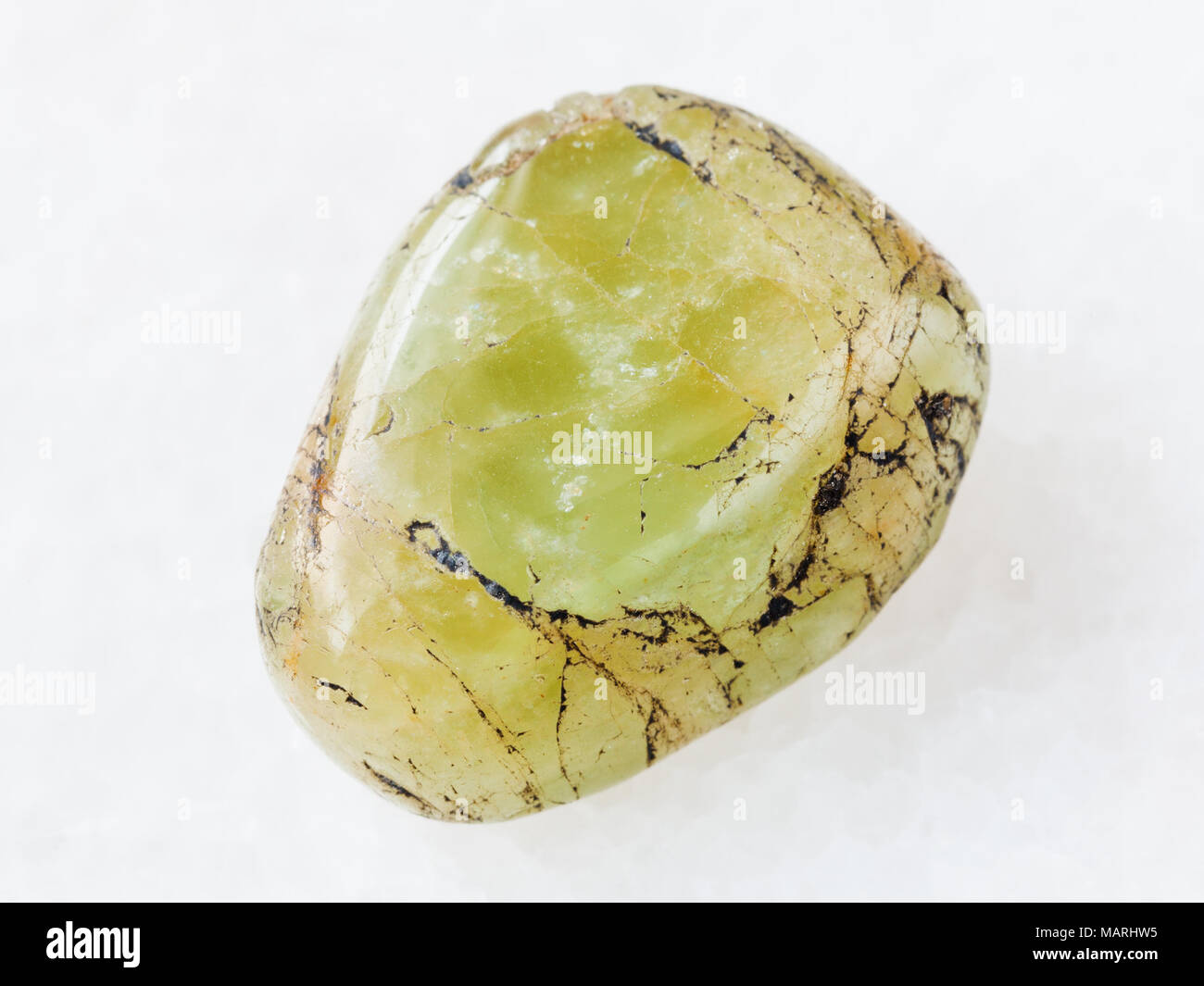 macro shooting of natural mineral rock specimen - tumbled green beryl ...