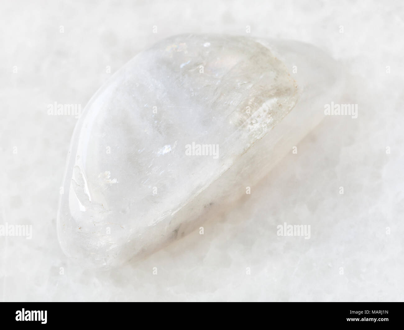 macro shooting of natural mineral rock specimen - polished white ...