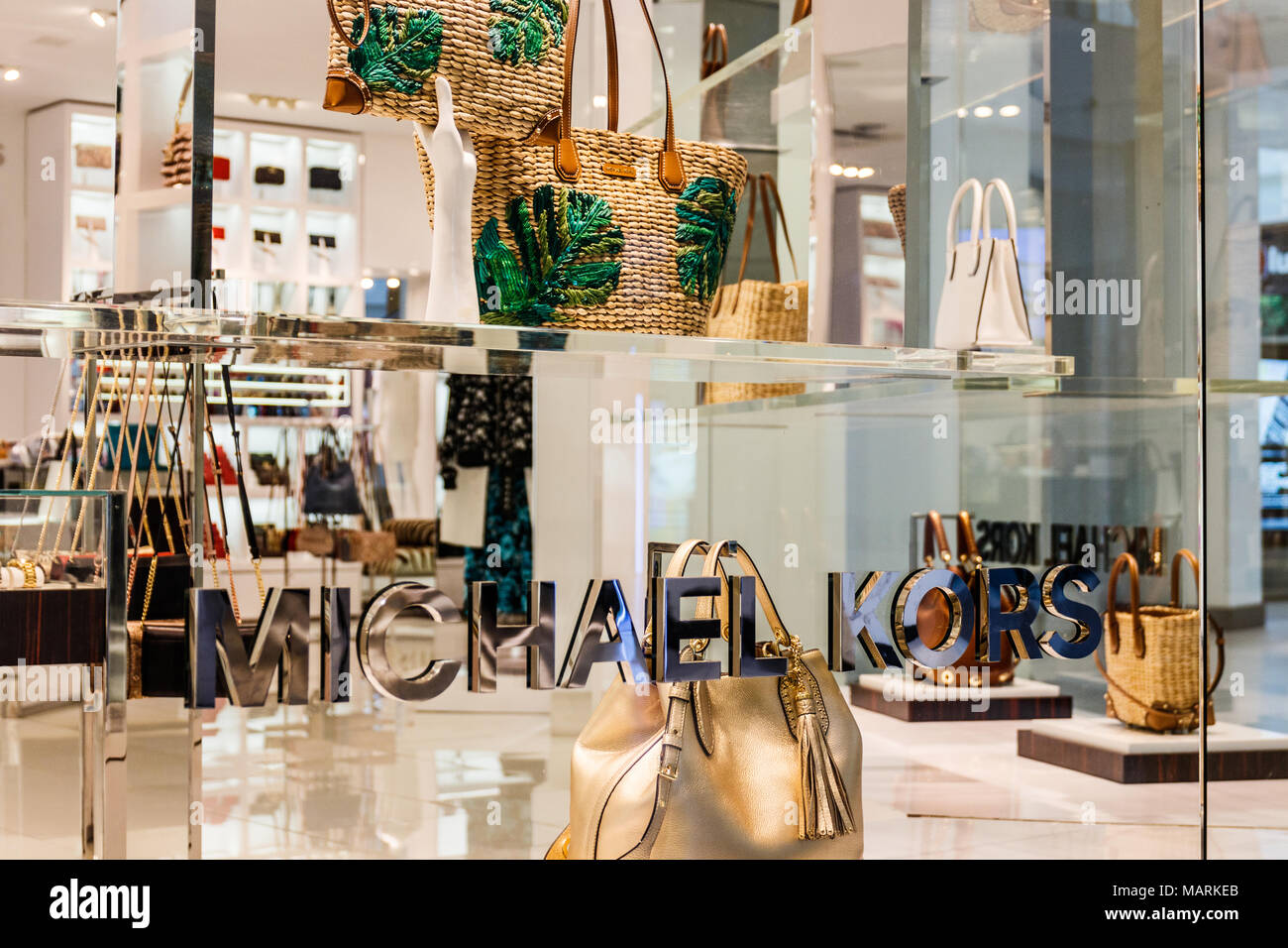 Handbags on display at the Michael Kors boutique within Macy's in New York  on Tuesday, August 4, 2015. First-quarter sales and profits for Michael  Kors handbag designer beat analysts' expectations, albeit low