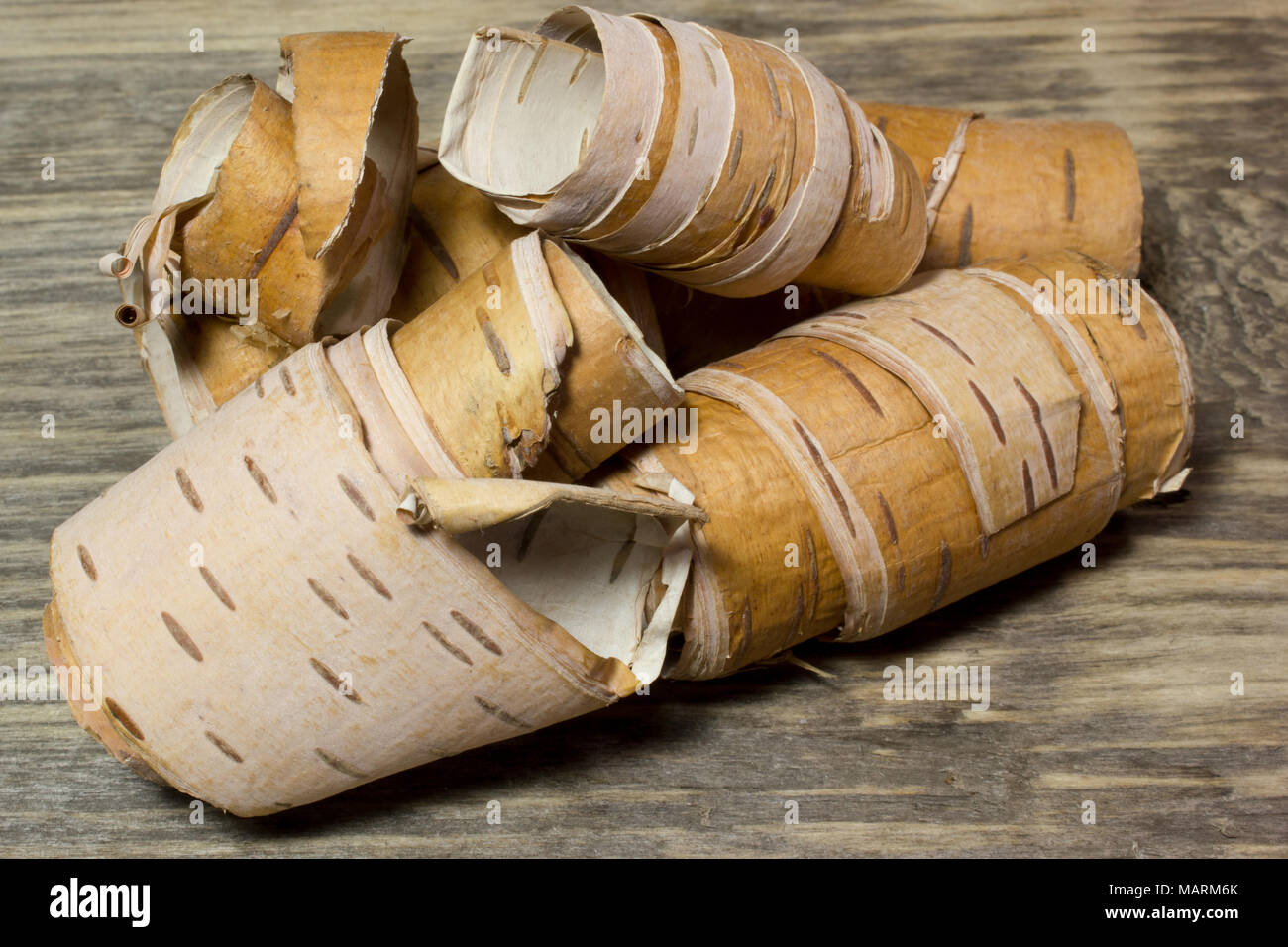 Rolls of birch Bark on wooden Stock Photo Alamy