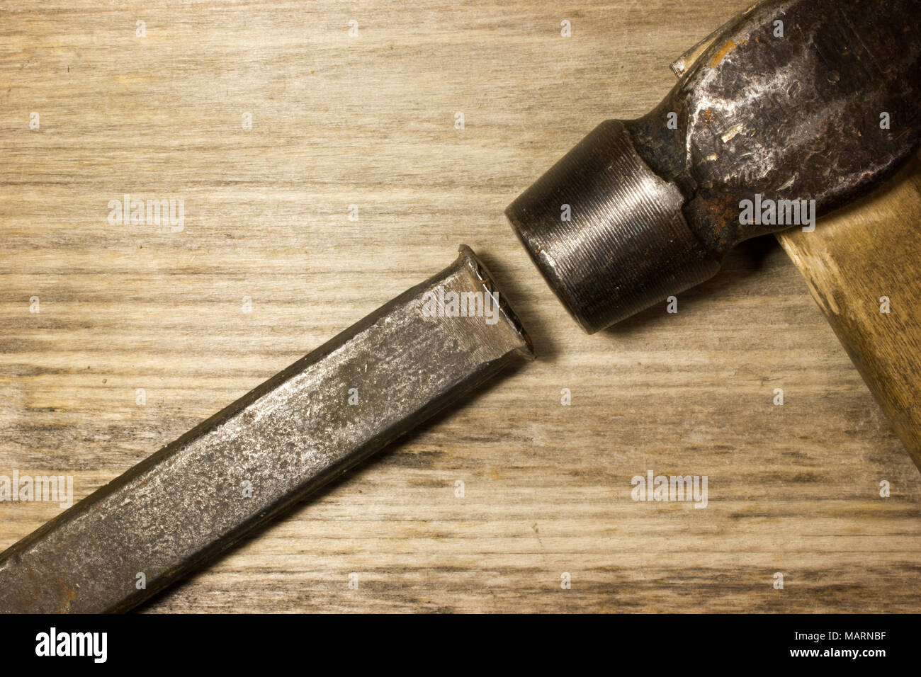 A hammer and chisel on wooden background Stock Photo