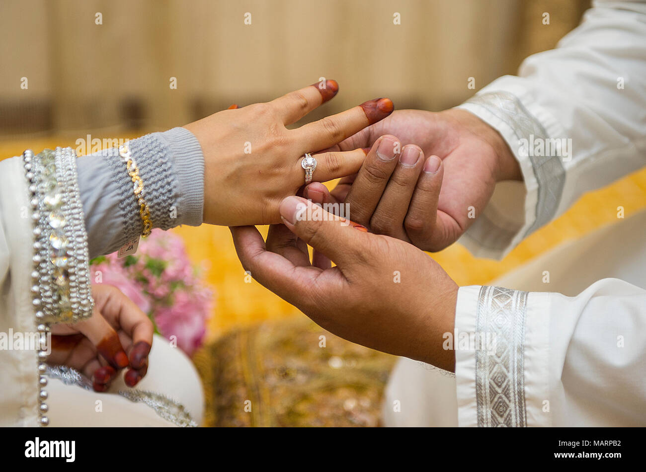 Malay wedding couple giving ring as a wedding present Stock Photo Alamy