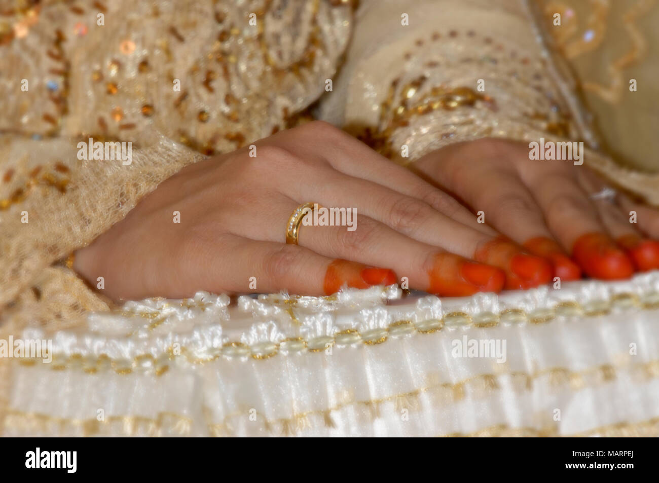 Hand of malay bride during their wedding ceremony Stock Photo
