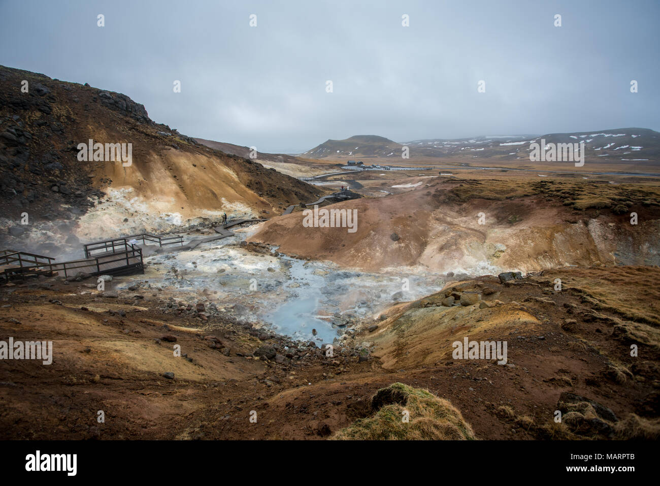 Geothermal area of Krysuvik at rainy and cloudy day in Iceland Stock Photo