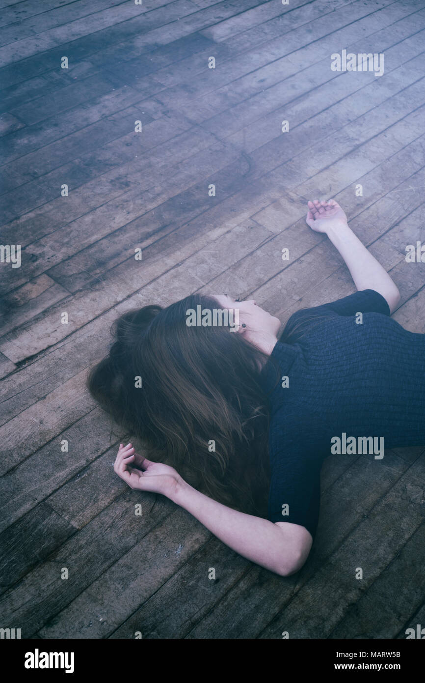 Body of a dead woman on the floor Stock Photo