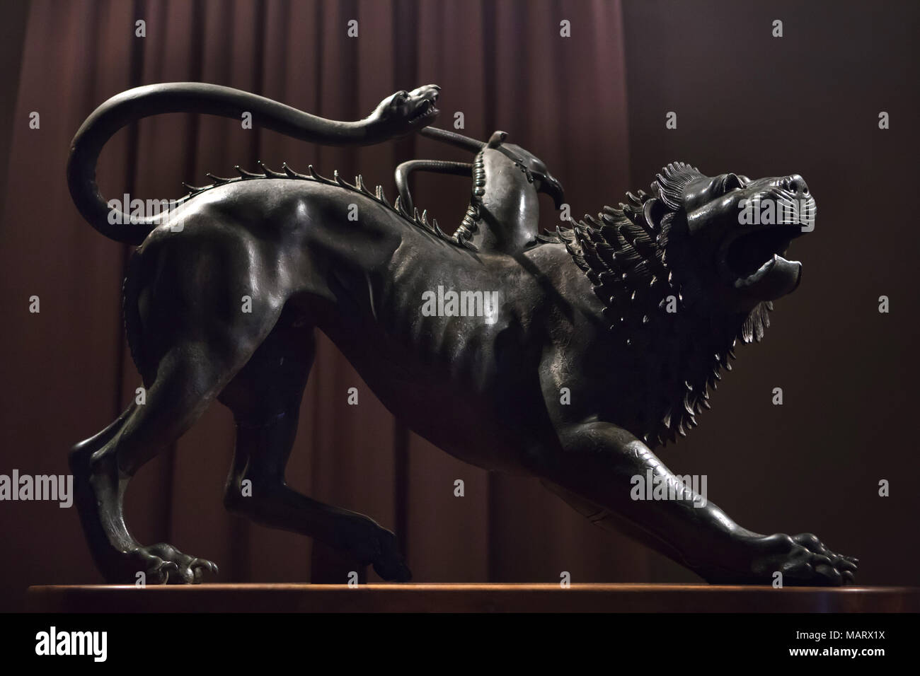 Etruscan bronze statue known as the Chimera di Arezzo (Chimera of Arezzo) dated from 400 BC on display in the Museo archeologico nazionale (National Archaeological Museum) in Florence, Tuscany, Italy. Stock Photo