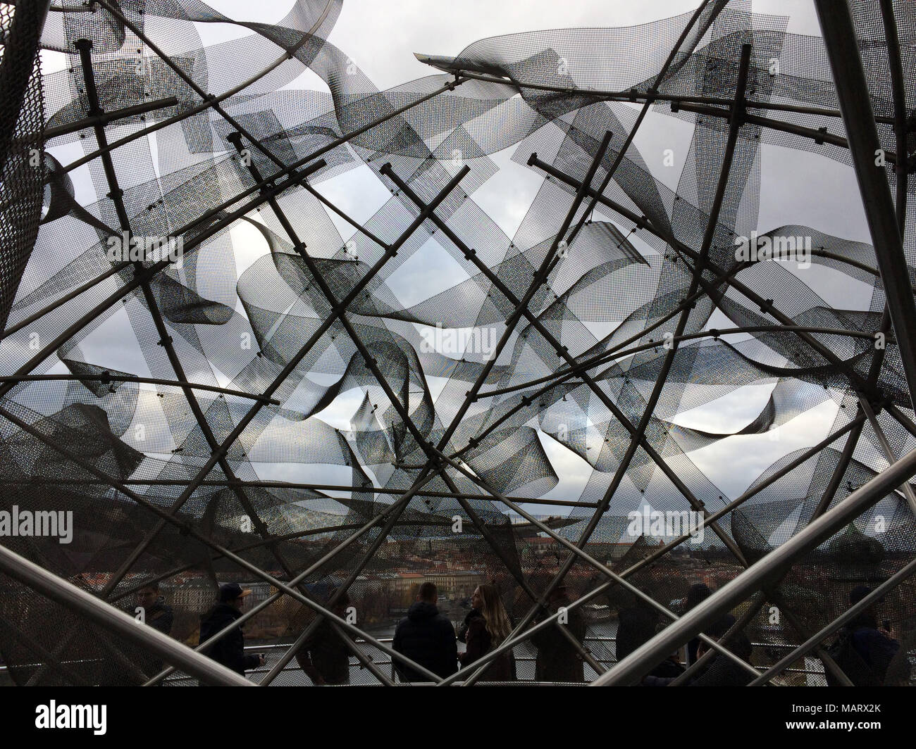 People enjoy the view from the rooftop terrace of the Dancing House (Tančící dům) designed by architects Vlado Milunić and Frank Gehry in Prague, Czech Republic. Stock Photo