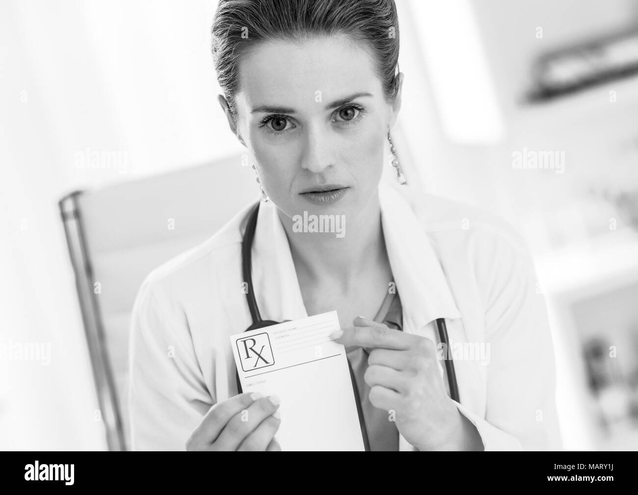 Medical doctor woman pointing on prescription Stock Photo