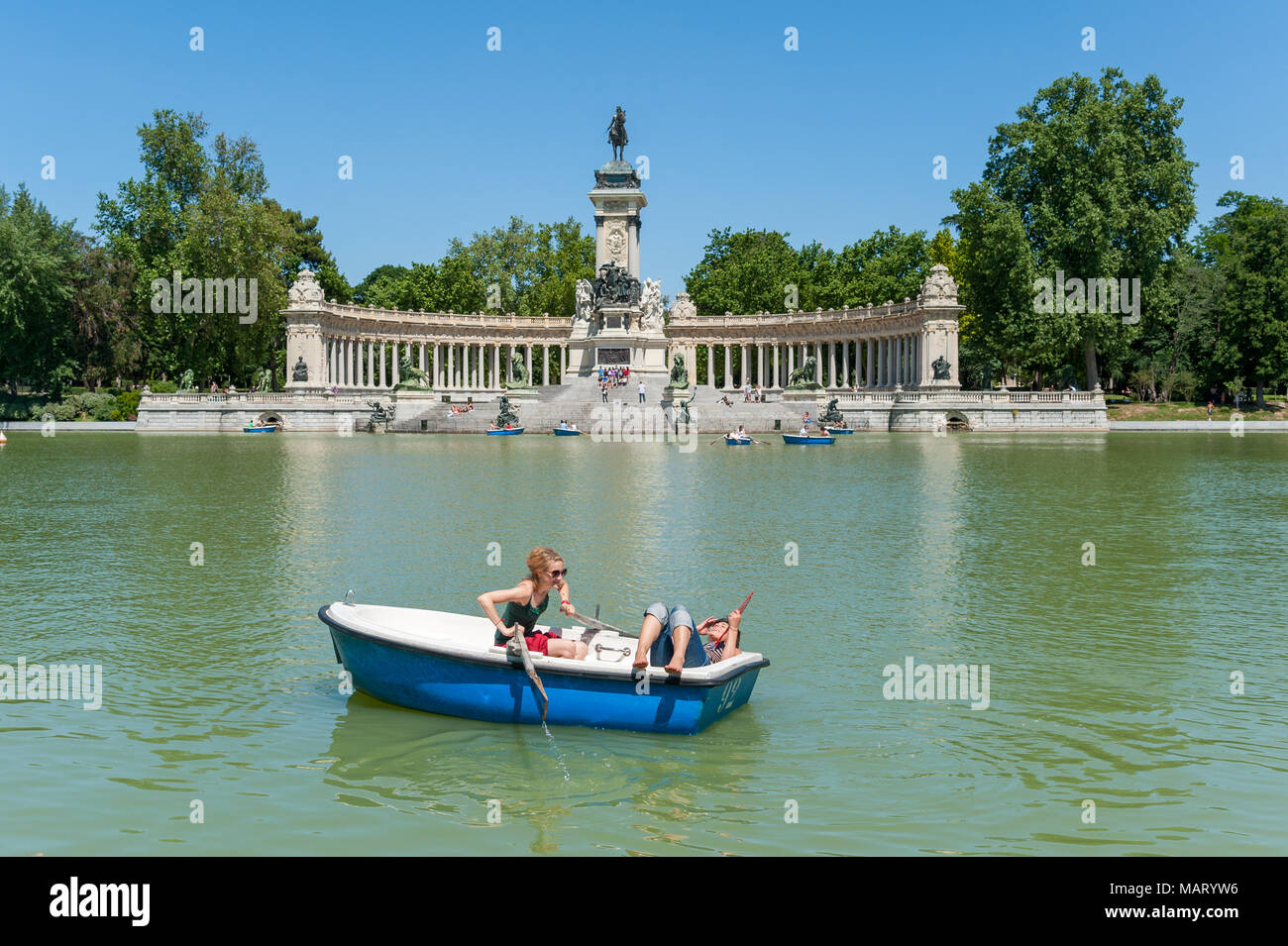 Young women having fun on the boating lake in Buen Retiro park, Madrid, Spain Stock Photo