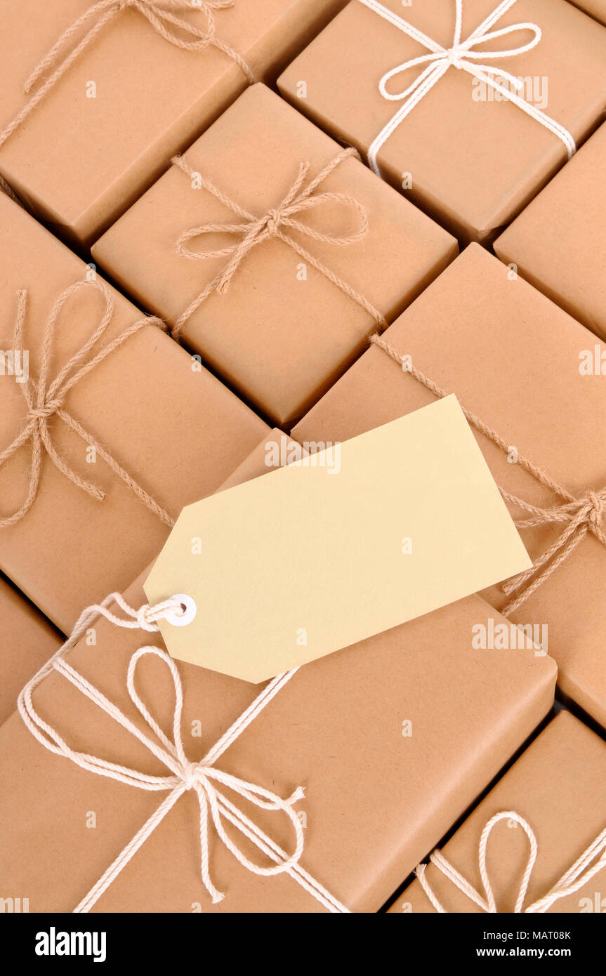 String tied in a bow on a brown recycled paper Stock Photo by ©bennyartist  36511483